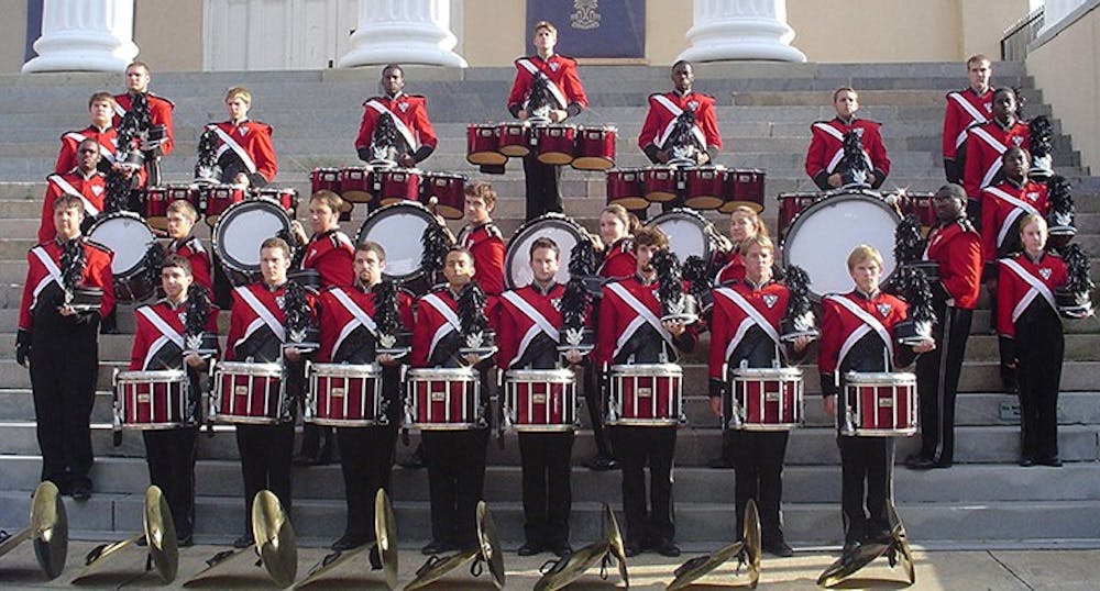 The 2004 Carolina Band drumline stands together at the steps of the Longstreet Theatre.