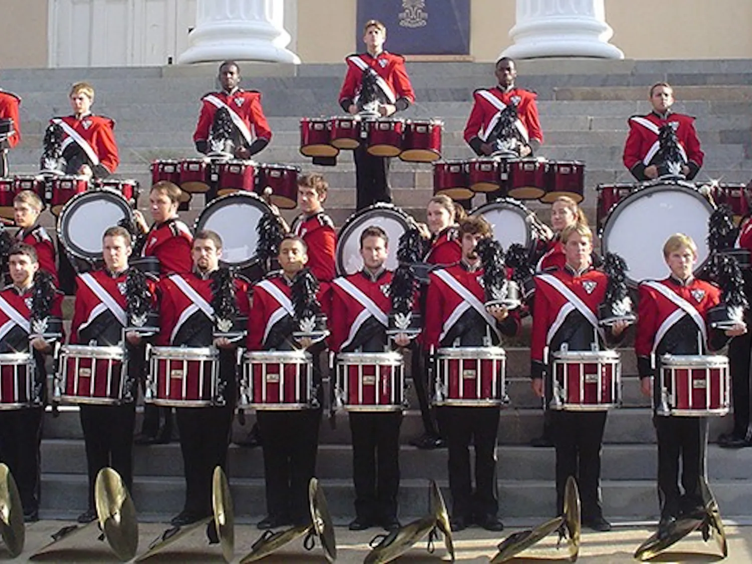 The 2004 Carolina Band drumline stands together at the steps of the Longstreet Theatre.