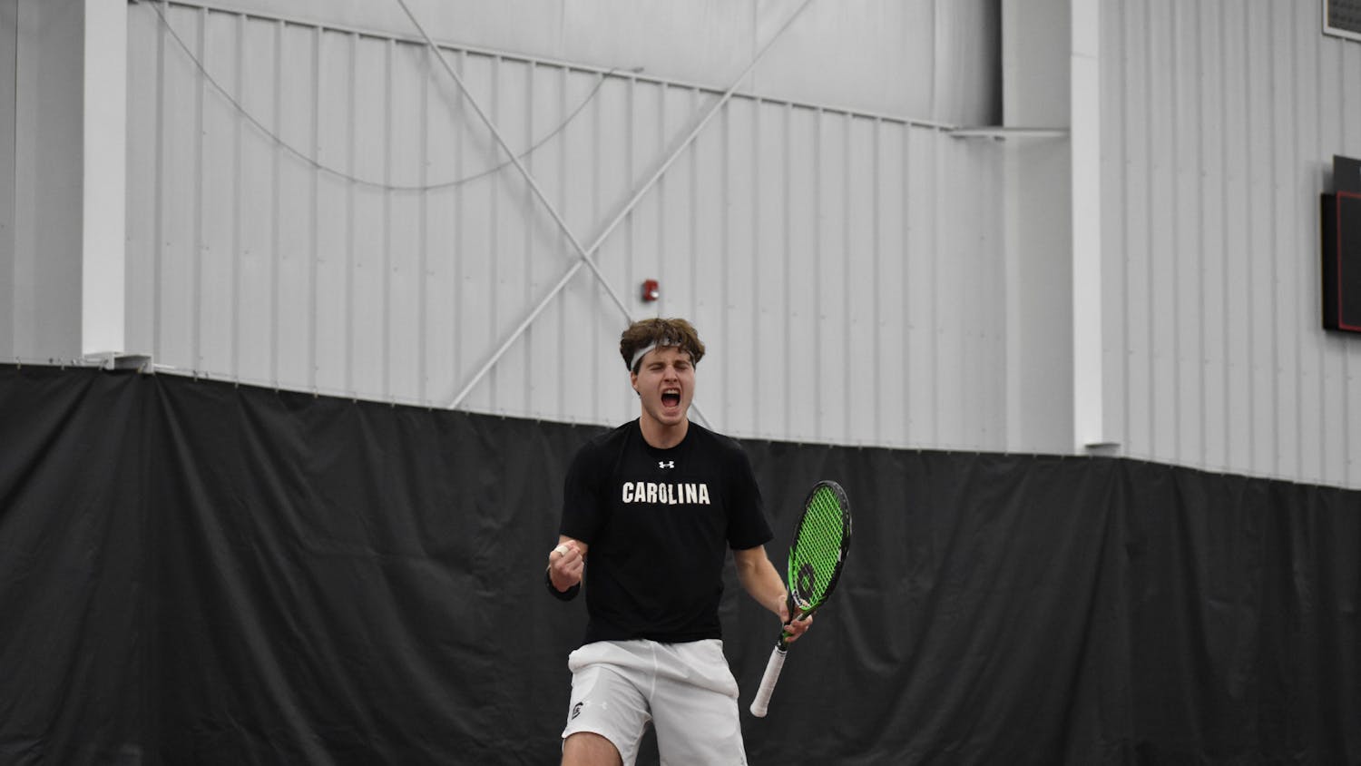 Junior Toby Samuel yells out in celebration after winning his singles game on day two of the ITA Kickoff Weekend event at the Carolina Indoor Tennis Center on Jan. 29, 2023. The South Carolina Gamecocks beat N.C. State 4-0, making it the winner of the ITA tournament.&nbsp;