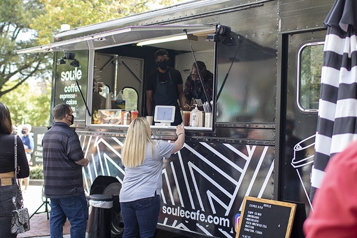 A customer ordering from the Soulé Coffee Truck. The truck is a popular attraction at Soda City for all types of drink creations.