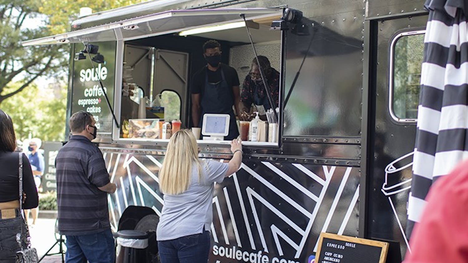 A customer ordering from the Soulé Coffee Truck. The truck is a popular attraction at Soda City for all types of drink creations.