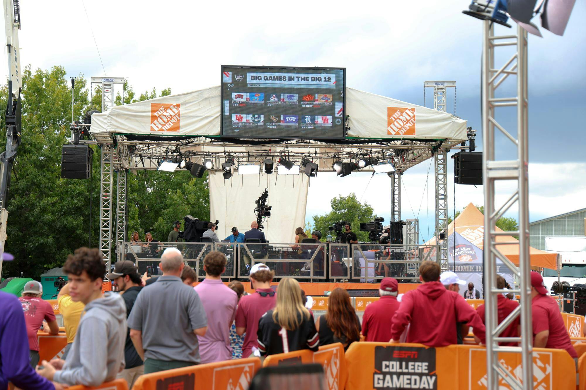 South Carolina fans stand behind the set of ESPN's 'College Football Live' show during filming at Gamecock Park on Sept. 13, 2024. Fans were allowed to walk through Gamecock Park to see the 'College GameDay' set and other activities being setup the day before South Carolina's matchup against No. 16 LSU.
