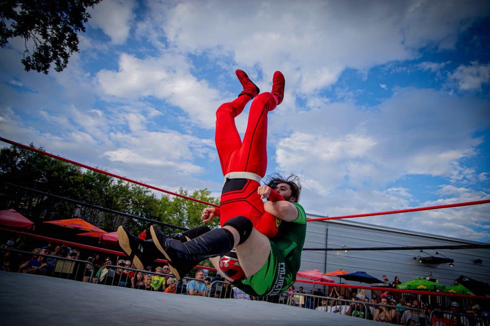 <p>Dennis Parker (green) pile drives Wrestle Ranger (red) during the Pro Wrestling TURBO on Aug. 24, 2025 at The Mill in Greenville, South Carolina. Based in South Carolina, the Pro Wrestling TURBO league brings together new and veteran wrestlers.</p>