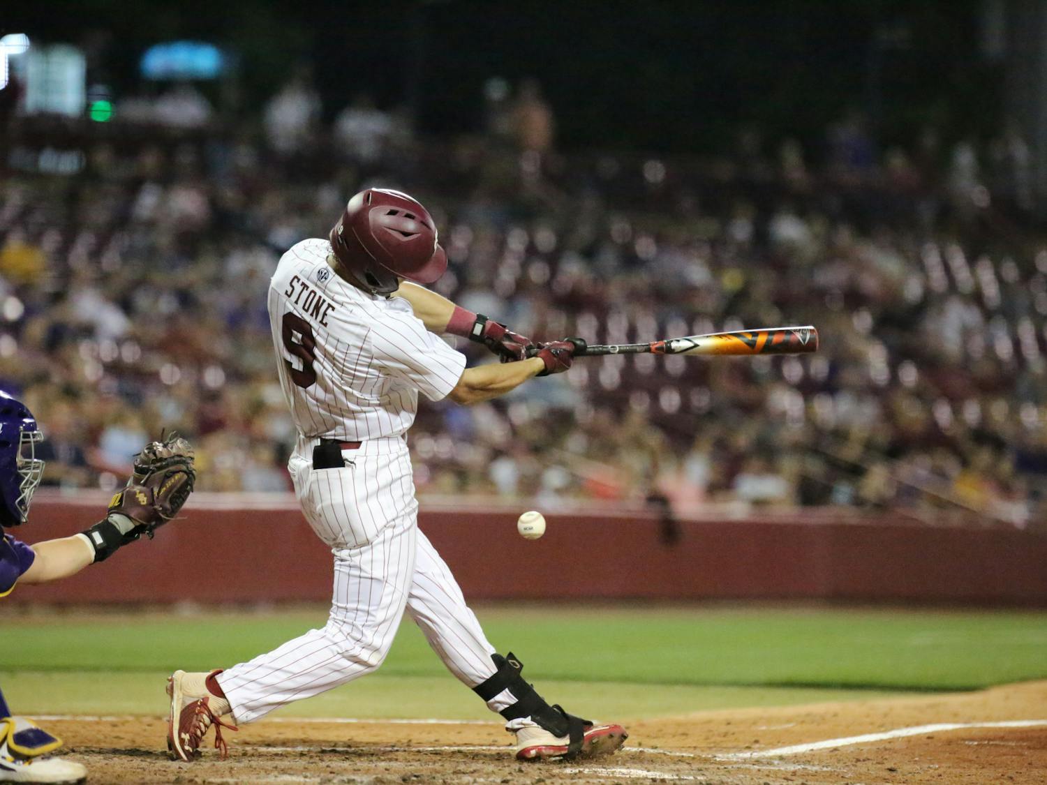 Sophomore outfielder Evan Stone swings at a pitch in hopes of getting on base for the Gamecocks and improving the lead against the LSU Tigers. No. 6 South Carolina won the first game of a two-game series 13-5 against No. 1 LSU on April 6, 2023.