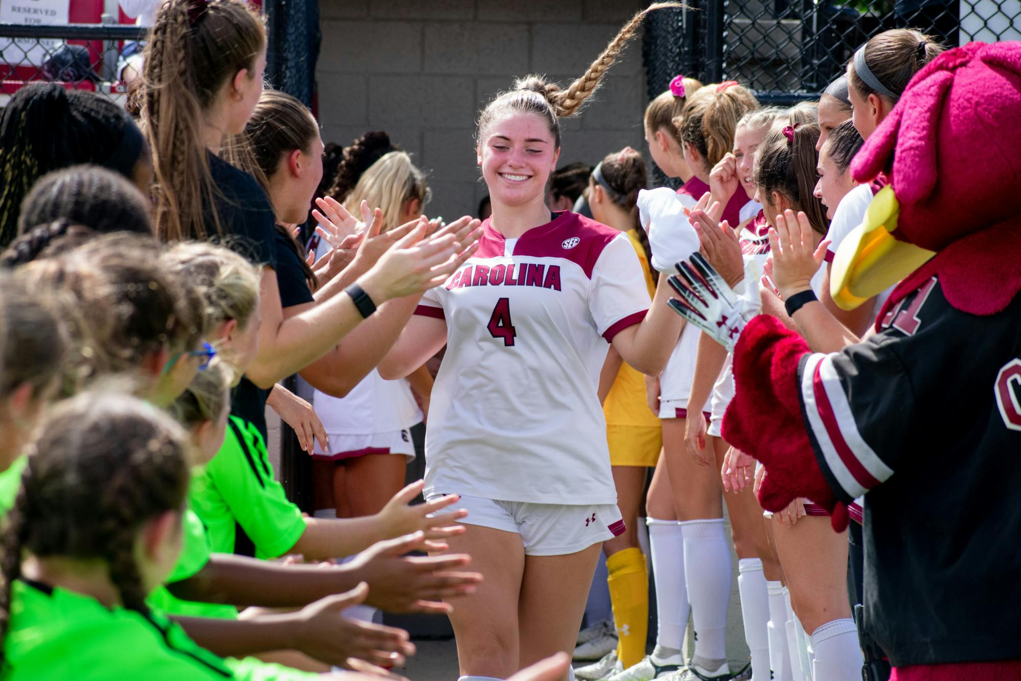 &nbsp;FILE — Freshman forward Sha O'Rourke high-fives her teammates as she makes her way to the field in preparation for their game against NC State on Sept. 11, 2022. The Gamecocks tied against the Wolfpack 0-0.&nbsp;