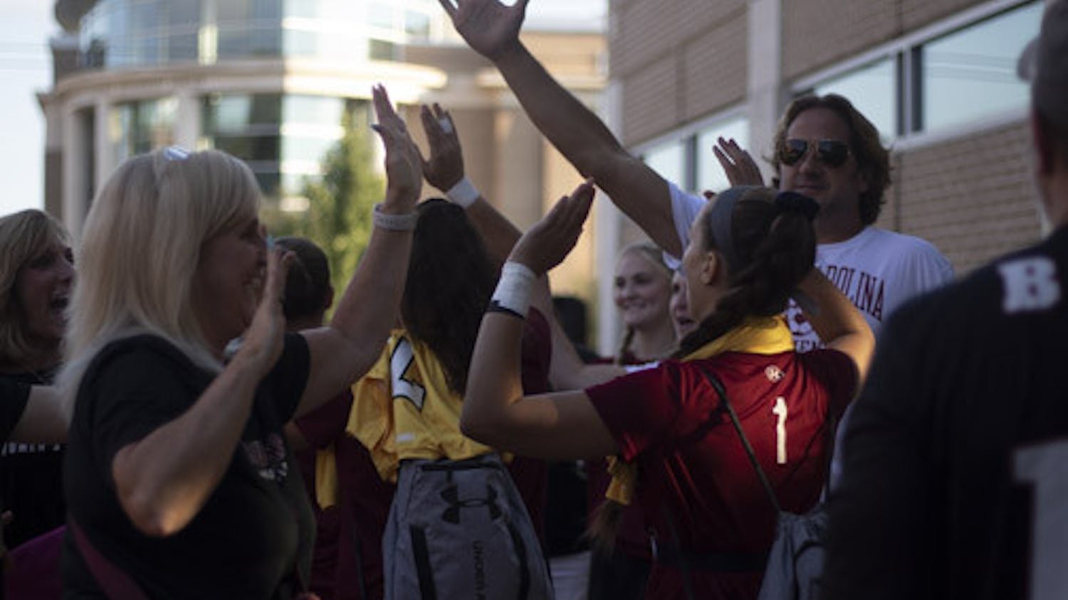 The South Carolina women’s soccer team high-fives surrounding families at a tailgate on Sept. 24, 2023. Families gathered to support the team before it took on Tennessee.