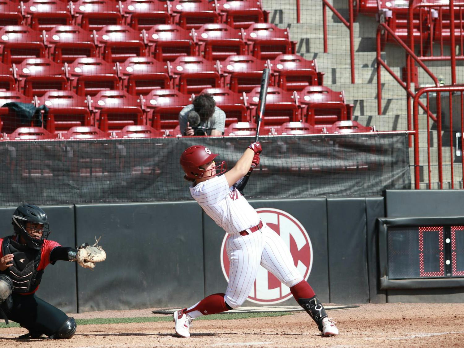Senior infielder Ella Chancey makes contact with the pitch at Carolina Softball Stadium on Feb. 23, 2025. Ella Chancey had two at-bats and four runs batted in during the game against the University of Nevada- Las Vegas with a 9-4 victory and continue its winning streak, 16-0.