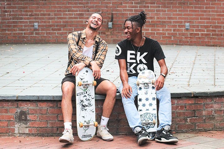 Second-year computer science student Andrew Dhillon, president of the Gamecock Skate Club, sits next to second-year computer engineering student Ta’Rajay Bowie, the vice president. Club members often skate outside Russell House and together have formed a community promoting health and unity through skateboarding.&nbsp;