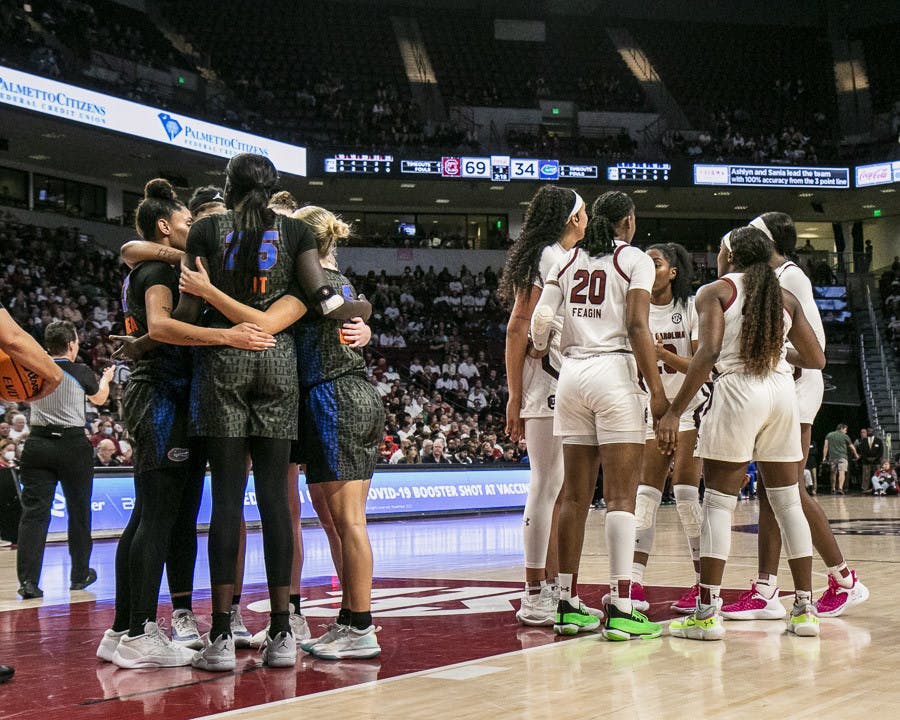 South Carolina and Florida huddle up after a foul during the match at Colonial Life Arena on Feb. 16, 2023. The Gamecocks beat the Gators 87-56.