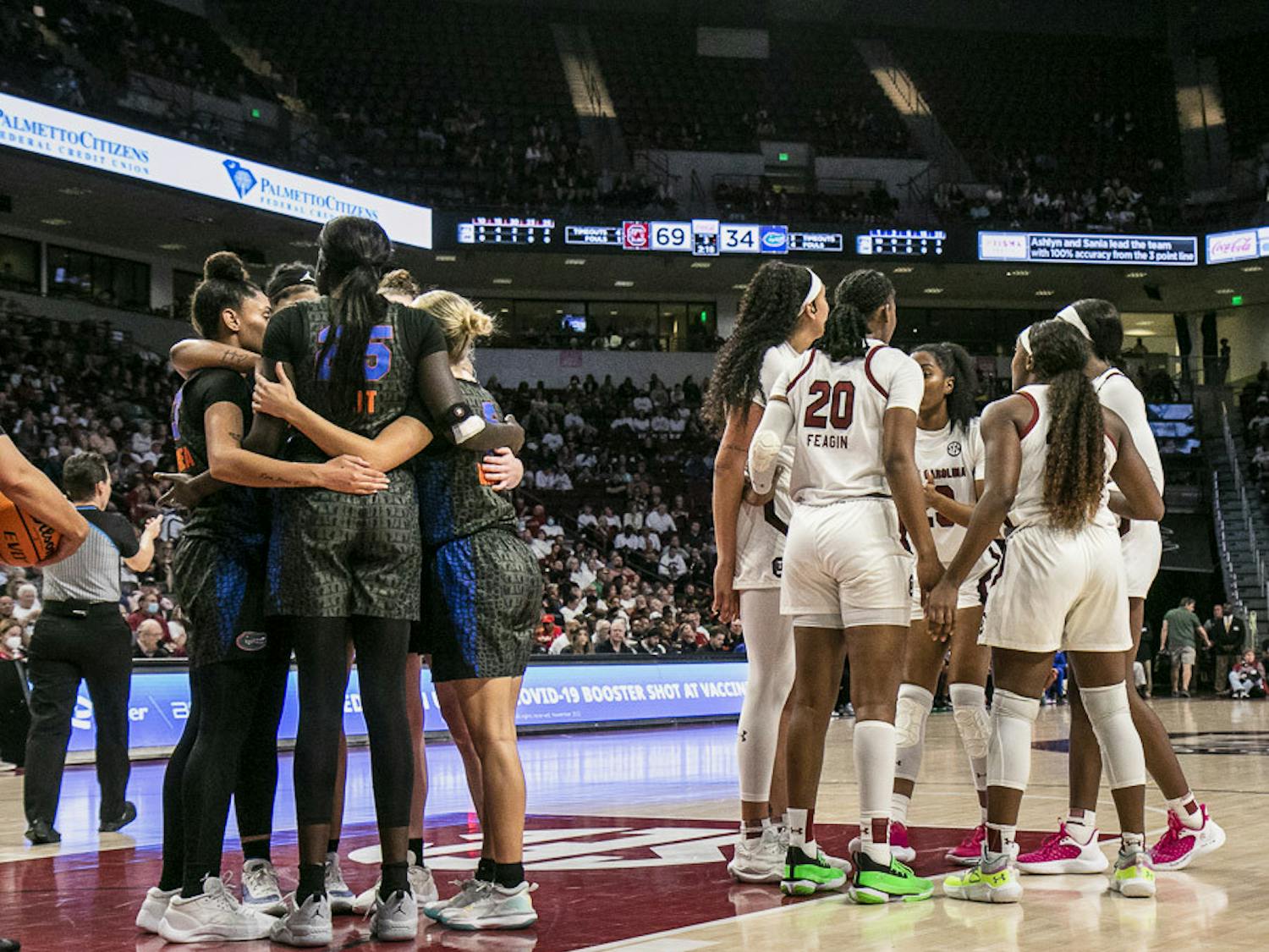 South Carolina and Florida huddle up after a foul during the match at Colonial Life Arena on Feb. 16, 2023. The Gamecocks beat the Gators 87-56.