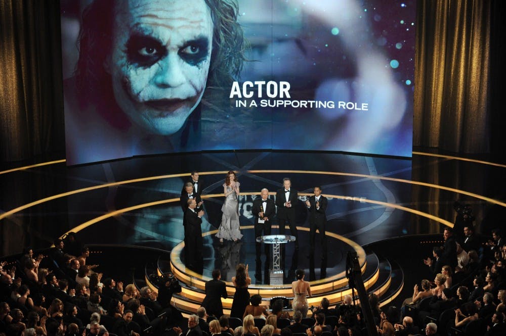 Heath Ledger's father Kim Ledger accepts the Oscar for best supporting actor on behalf of Heath Ledger who won for his work in "The Dark Knight" during the 81st Academy Awards in Hollywood, California, Sunday, February 22, 2009. (Michael Goulding/Orange County Register/MCT)