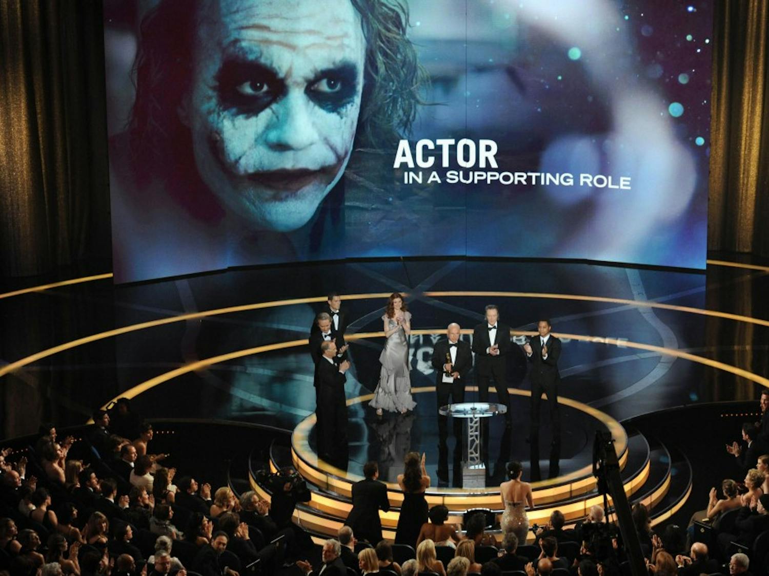 Heath Ledger's father Kim Ledger accepts the Oscar for best supporting actor on behalf of Heath Ledger who won for his work in "The Dark Knight" during the 81st Academy Awards in Hollywood, California, Sunday, February 22, 2009. (Michael Goulding/Orange County Register/MCT)