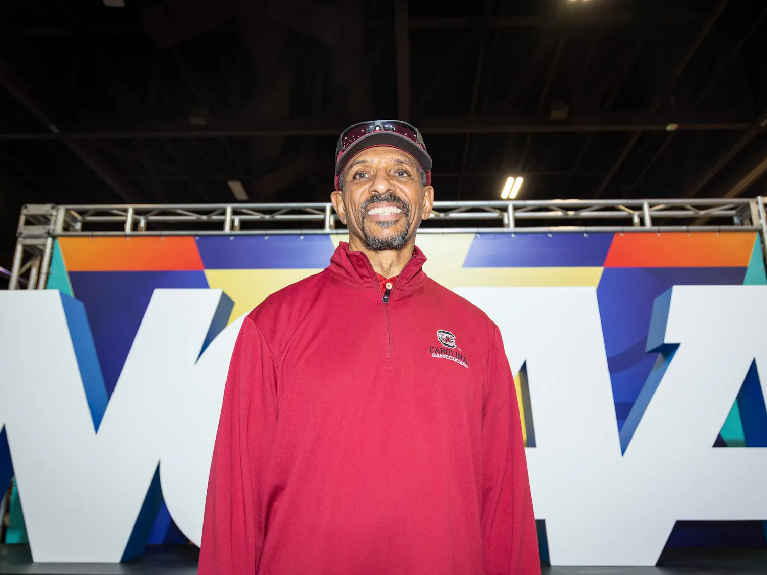 South Carolina supporters, many dressed in garnet and black, filled fan spaces and streets in Phoenix, Arizona, as they gathered for the NCAA Final Four. Fans posed for photos, played basketball-themed games and stopped to read displays, while others lingered outside the arena in jerseys bearing familiar names. Families, alumni and longtime supporters traveled across the country to be part of the moment.