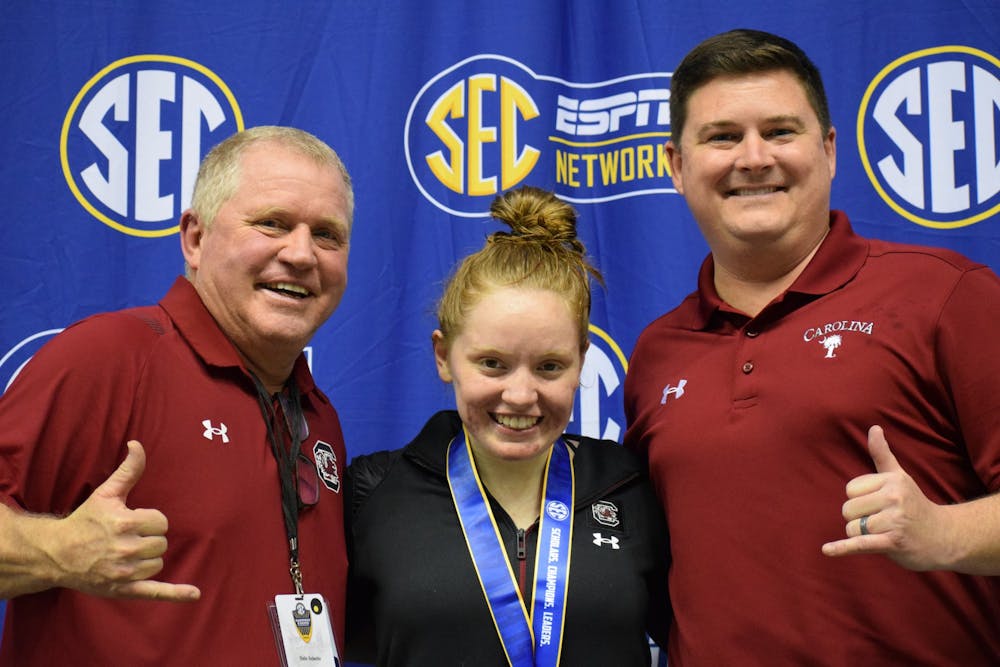 <p>Graduate student Brooke Schultz poses with her father (left) following a swim meet this year. Schultz has been named SEC Diver of the Week twice since joining South Carolina.</p>