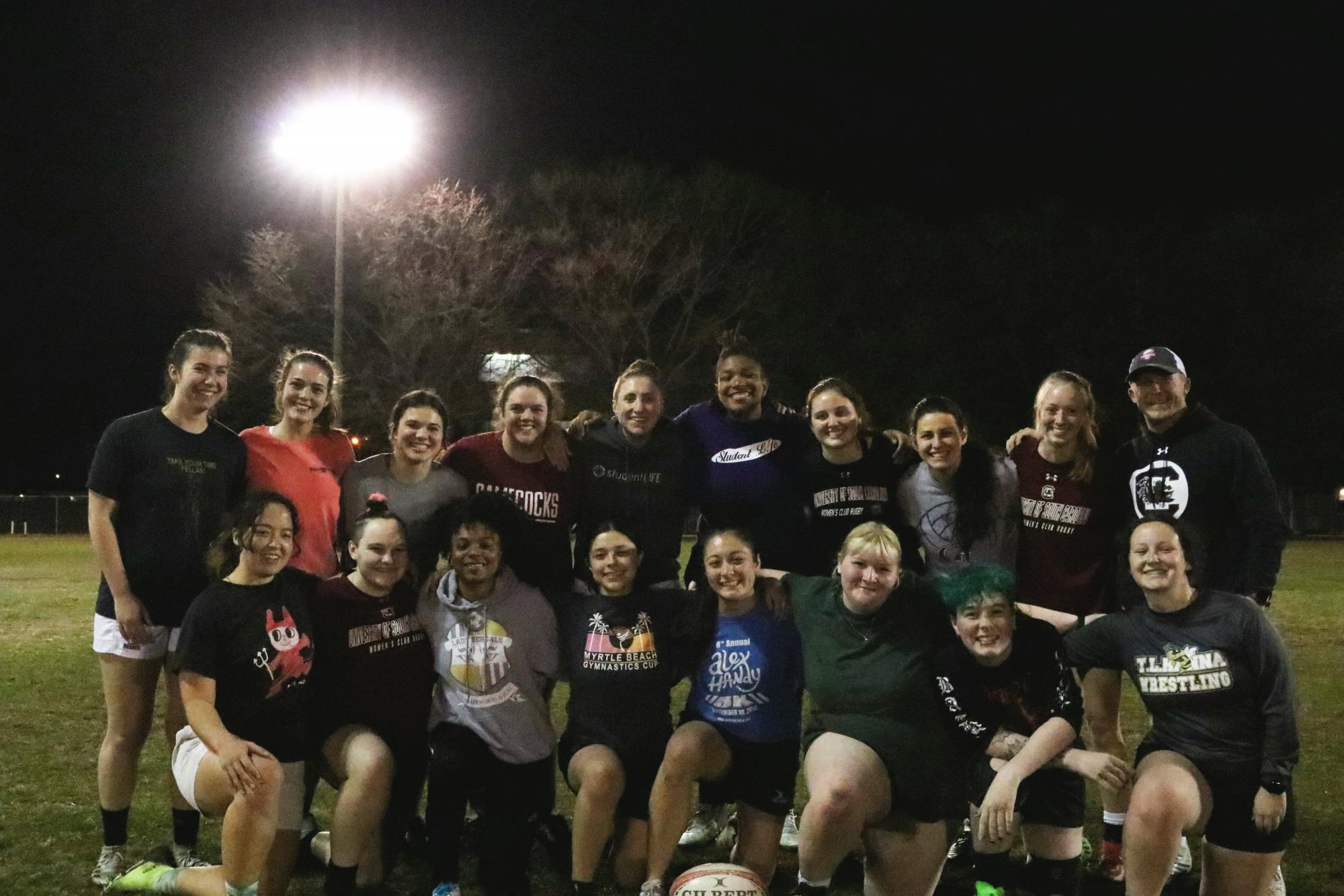 The Gamecocks women’s rugby team takes a quick break from their practice at the Bluff Road Park fields to pose for a team portrait on Feb. 7, 2023. The team uses this time to improve the power of its game performance and ensure everyone is in a good place with school and everyday life.