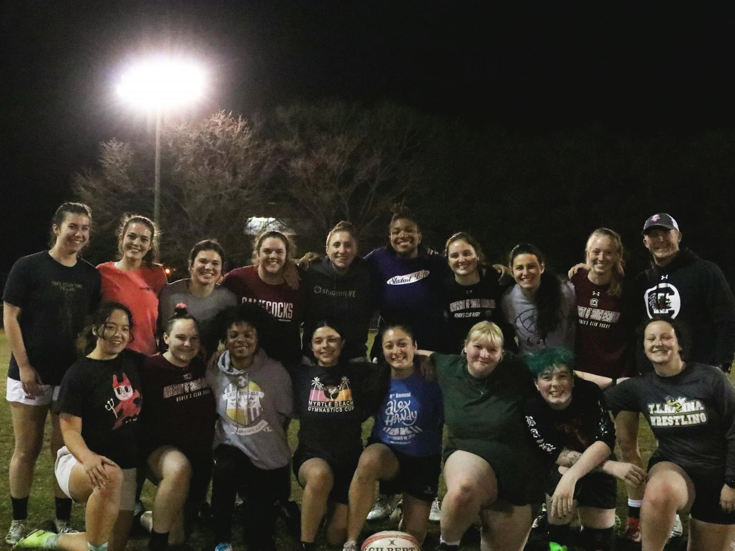 The Gamecocks women’s rugby team takes a quick break from their practice at the Bluff Road Park fields to pose for a team portrait on Feb. 7, 2023. The team uses this time to improve the power of its game performance and ensure everyone is in a good place with school and everyday life.