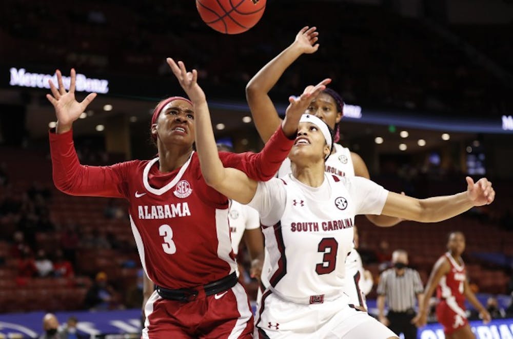 <p>Junior guard Destanni Henderson fights for a loose ball in the South Carolina's win over Alabama Friday. The Gamecocks will play Tennessee Saturday for the SEC tournament semifinals.</p>