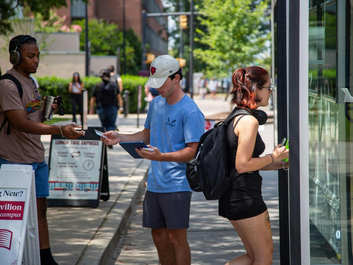 Students walking to board the lunch shuttle heading to Campus Village on Aug. 26, 2024. Campus Village, which opened in the 2023-2024 school year at the University of South Carolina, is the newest dorm on the west side of campus.