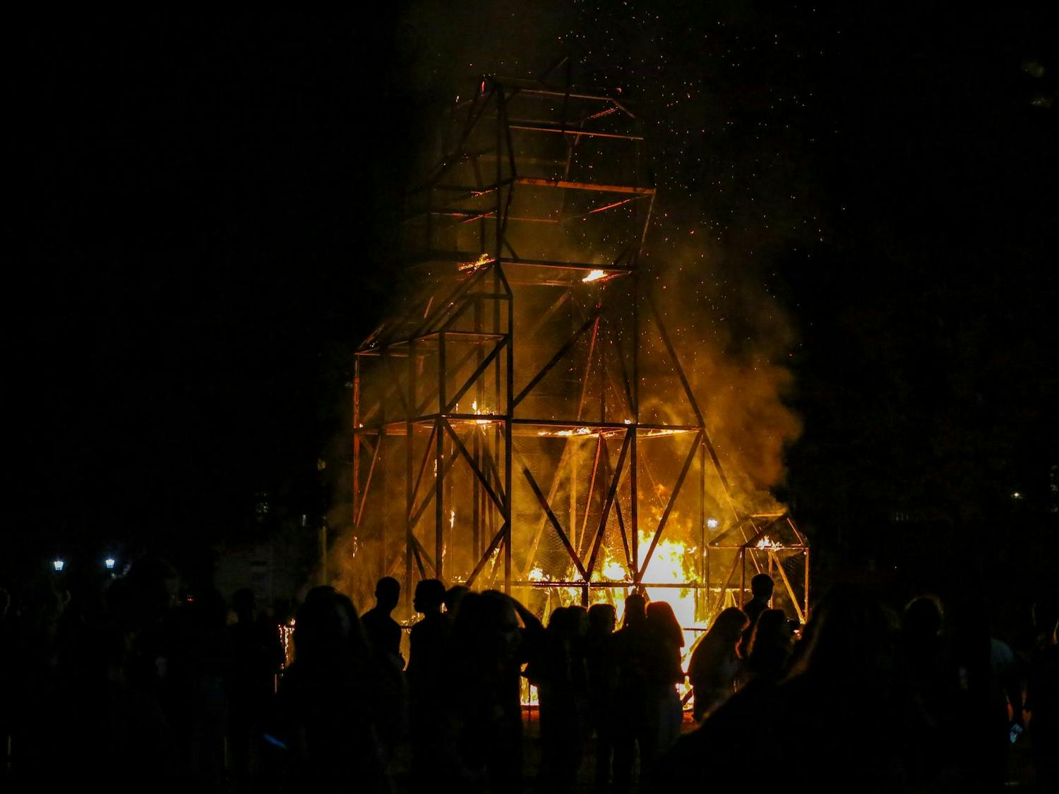 South Carolina students watch as a tiger statue burns during Tiger Burn at Blatt Field on Nov. 19, 2025. The statue is stuffed with scrap wood, cardboard, palettes, cardboard, pine straw and hay before being doused with lighter fluid and ignited in front of spectators.