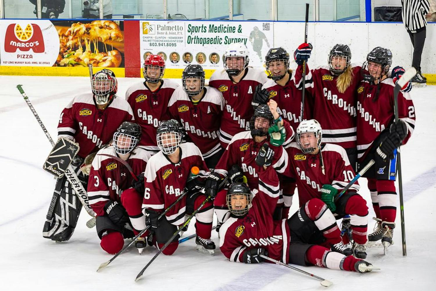 The University of South Carolina's Women's Club Ice Hockey team celebrates after its 2-1 victory against the U-19 South Carolina Lady Warriors on Oct. 1, 2023, in Irmo, South Carolina. The women's hockey team went on to play in the collegiate hockey playoffs.