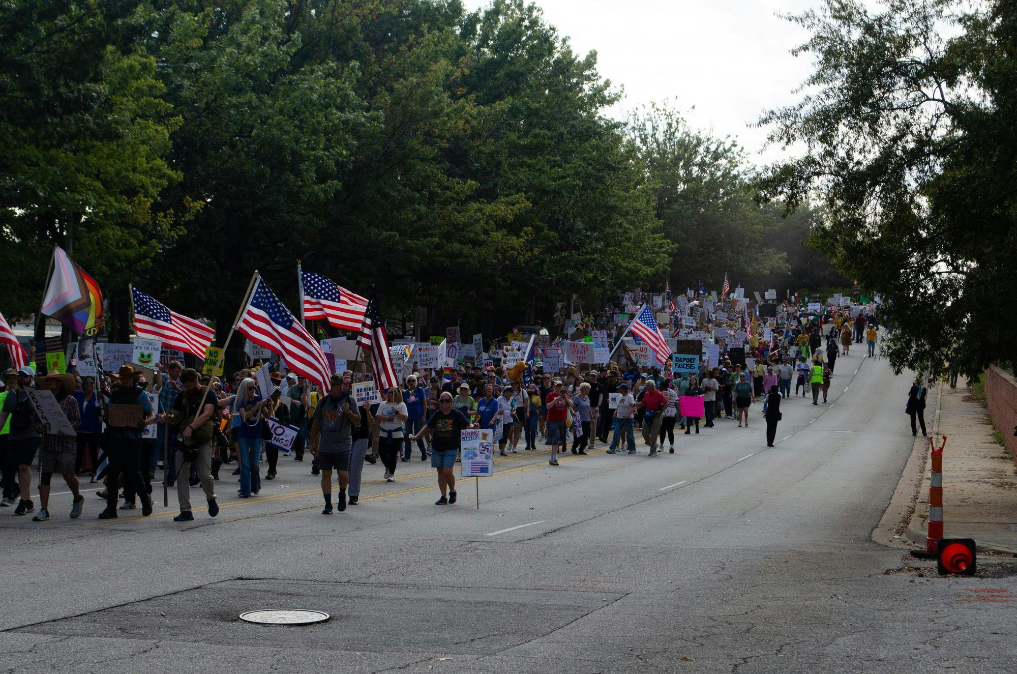 Protesters wave signs and American flags at a "No Kings" protest in Columbia, South Carolina on Oct. 18, 2025. The president’s Republican Party allies have claimed the protests are anti-American.