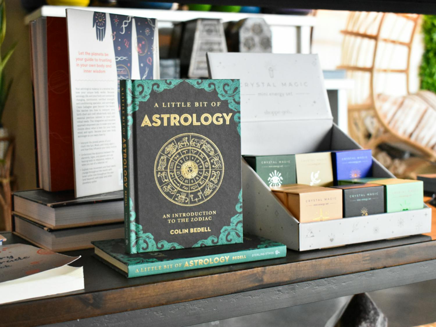 Spiritual books sit on a table in The Healing Bar on Jan. 26, 2023. The readings range from focusing on the divine self to astrology.