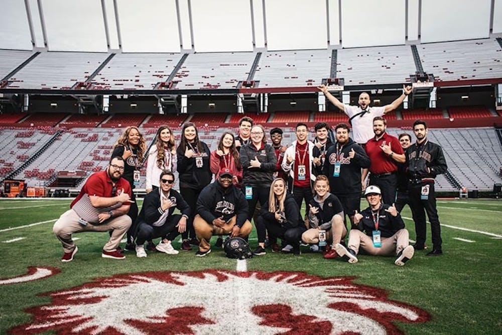 The media team gathered for a team photo at Williams-Brice Stadium before a home game during the 2019 season.