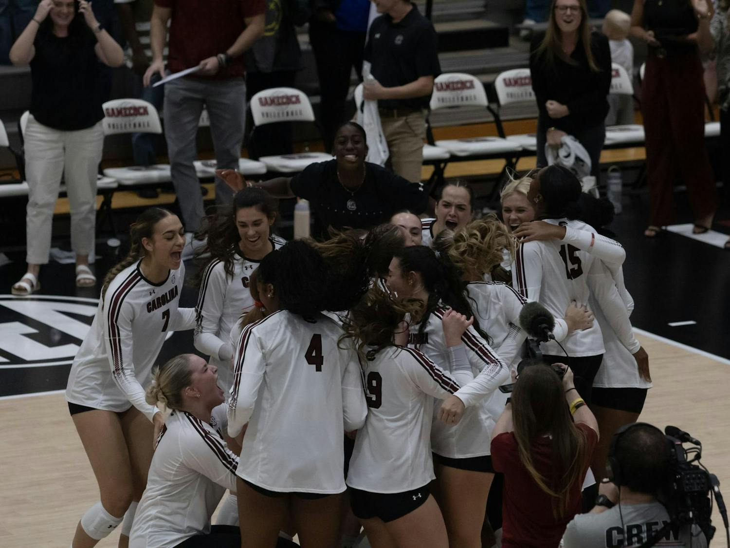 The South Carolina women's volleyball team celebrate its win in game against the University of North Carolina on Sept. 12, 2025, at the Carolina Volleyball Center. The South Carolina volleyball team took down its first ranked opponent 3-2.