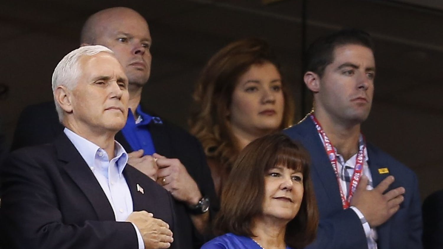 Vice President Mike Pence covers his heart along with his wife, Karen, right, during the national anthem as the Indianapolis Colts play host the San Francisco 49ers at Lucas Oil Stadium on Sunday, Oct. 8, 2017, in Indianapolis. (Sam Riche/TNS)