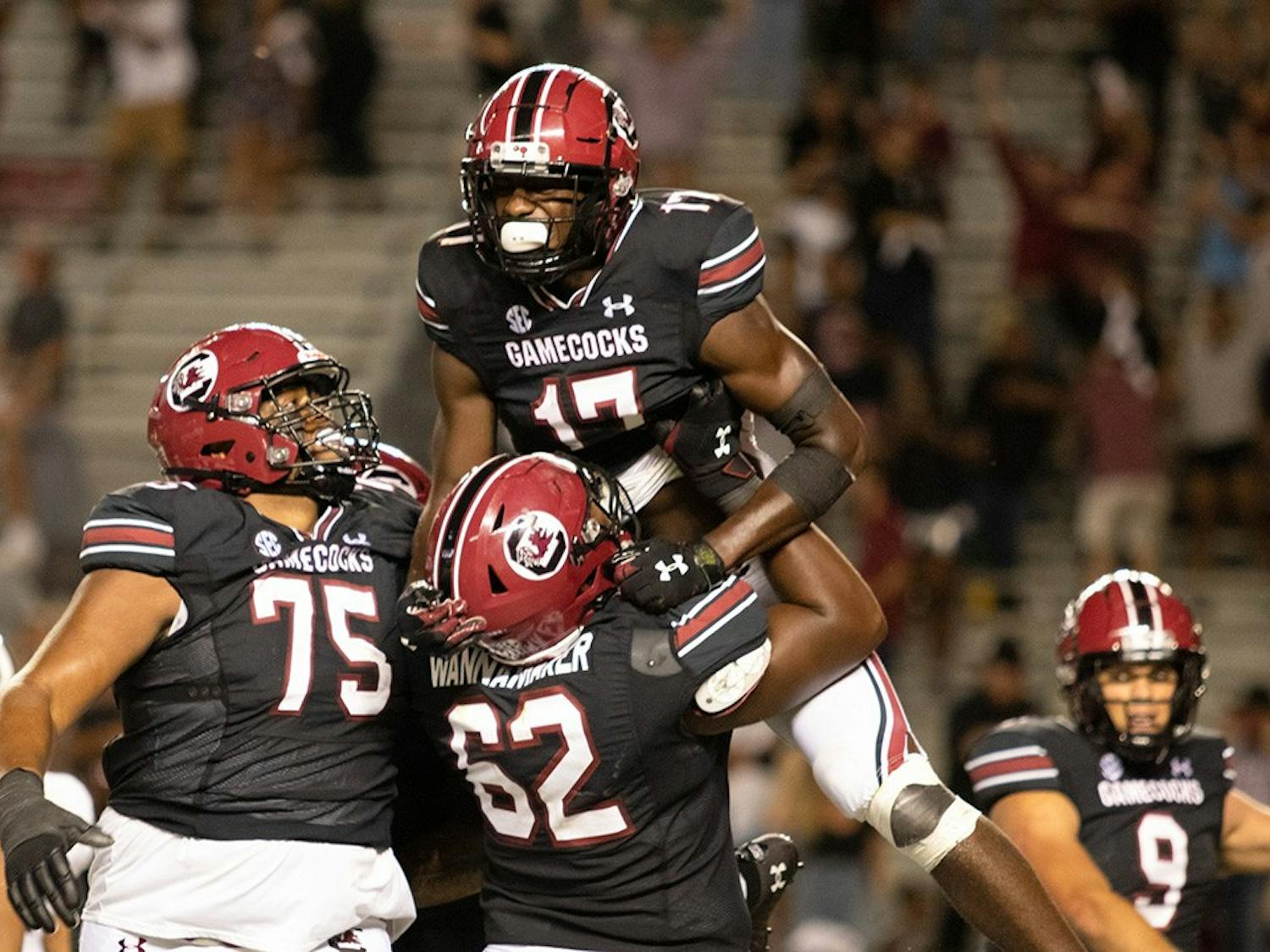 Gamecock football players celebrate junior wide receiver Xavier Legette after he caught the winning touchdown pass. The Gamecocks defeated the Vanderbilt Commodores with a touchdown in the fourth quarter. 