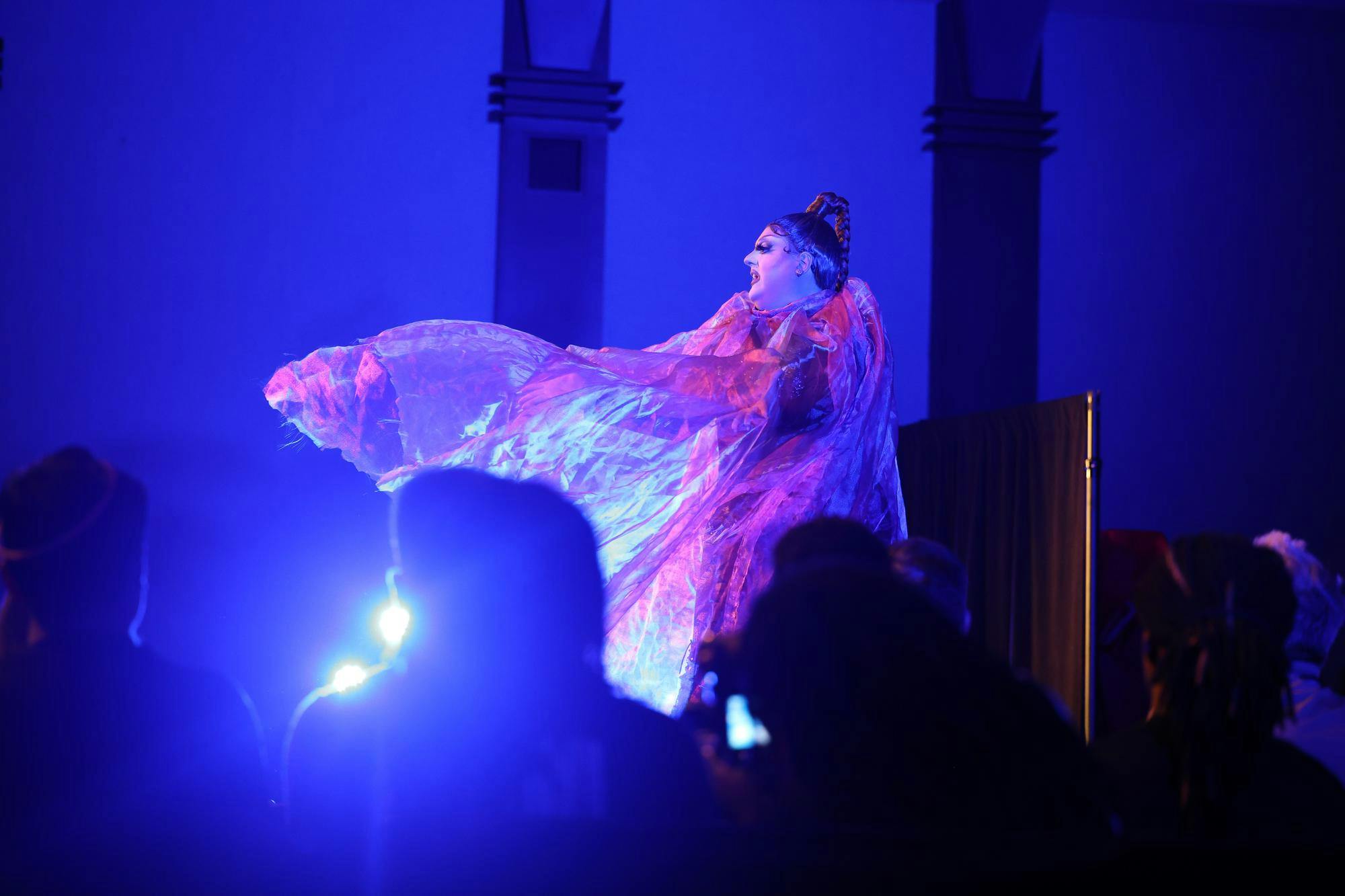 Drag queen Gouda Judy performs and lip-syncs on stage April 14, 2026, in the Russell House Ballroom. All the drag performers who attended the event were from South Carolina.
