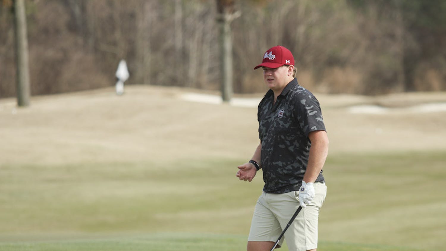 Fifth-year golfer Evans Lewis watches after he putts the ball during practice on Feb. 8, 2023. After placing highest individually at the Norman Regionals in Oklahoma last season, Lewis was the only member of the Gamecocks to make it to the national championship.