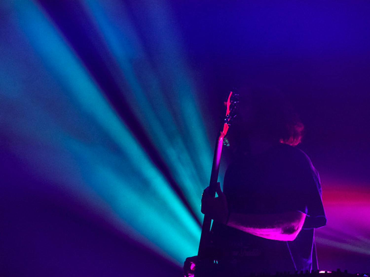 Stage lights backlight The Band CAMINO stand-in bassist Reagan Renfrow during the band's headlining act at The Senate on Sept. 15, 2022.