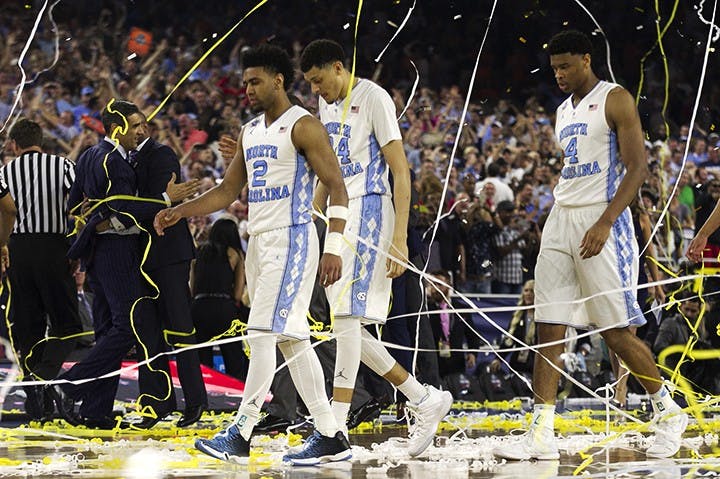 North Carolina&apos;s Joel Berry II (2), Justin Jackson (44), Isaiah Hicks (4) and Brice Johnson (11) walk off the court after Villanova&apos;s 77-74 victory on Monday, April 4, 2016, at NRG Stadium in Houston. (Robert Willett/Raleigh News &amp; Observer/TNS)