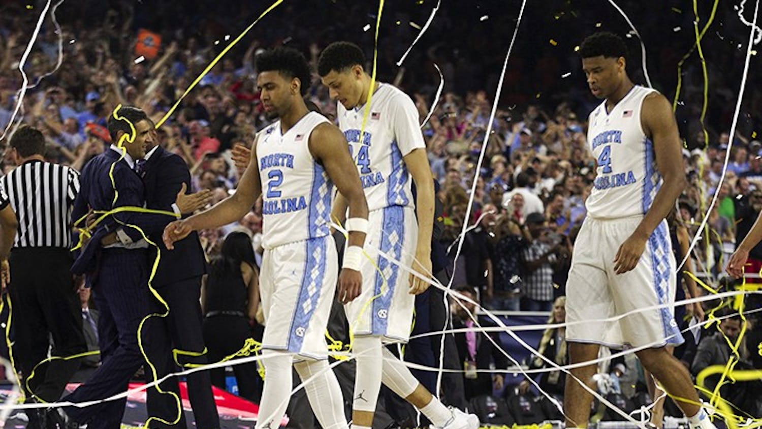 North Carolina's Joel Berry II (2), Justin Jackson (44), Isaiah Hicks (4) and Brice Johnson (11) walk off the court after Villanova's 77-74 victory on Monday, April 4, 2016, at NRG Stadium in Houston. (Robert Willett/Raleigh News & Observer/TNS)