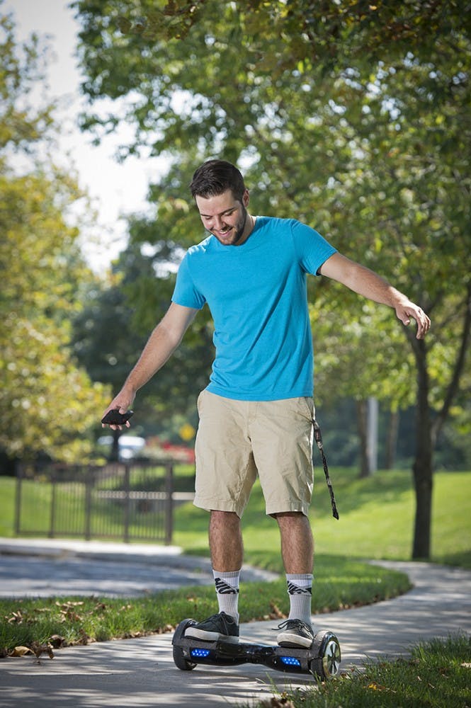 Logan Meis, 20, rides his hover board outside his apartment complex in Overland Park, Kan., on Friday, Sept. 4, 2015. Meis purchased the personal transportation device for about $330 online. (Tammy Ljungblad/Kansas City Star/TNS)