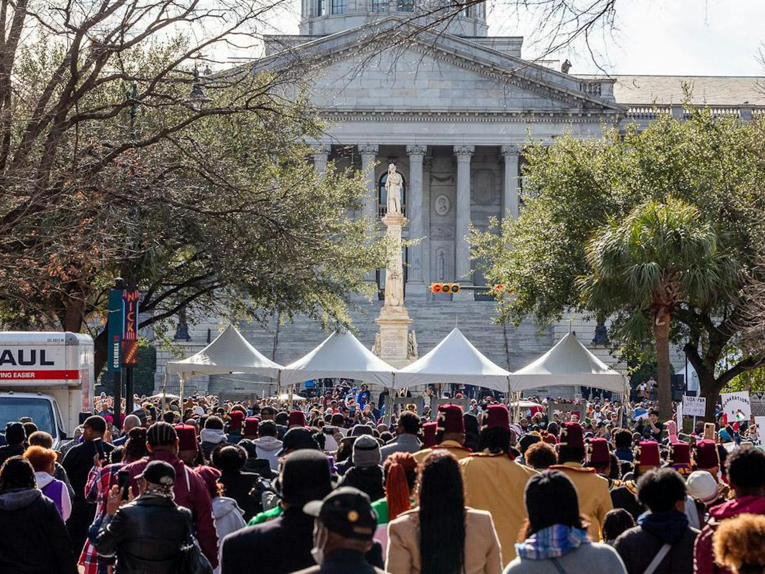 Members of the community march toward the South Carolina Statehouse before the King Day at the Dome event on Jan. 15, 2024. Additional security monitored the event as Vice President Kamala Harris was present as the keynote speaker.