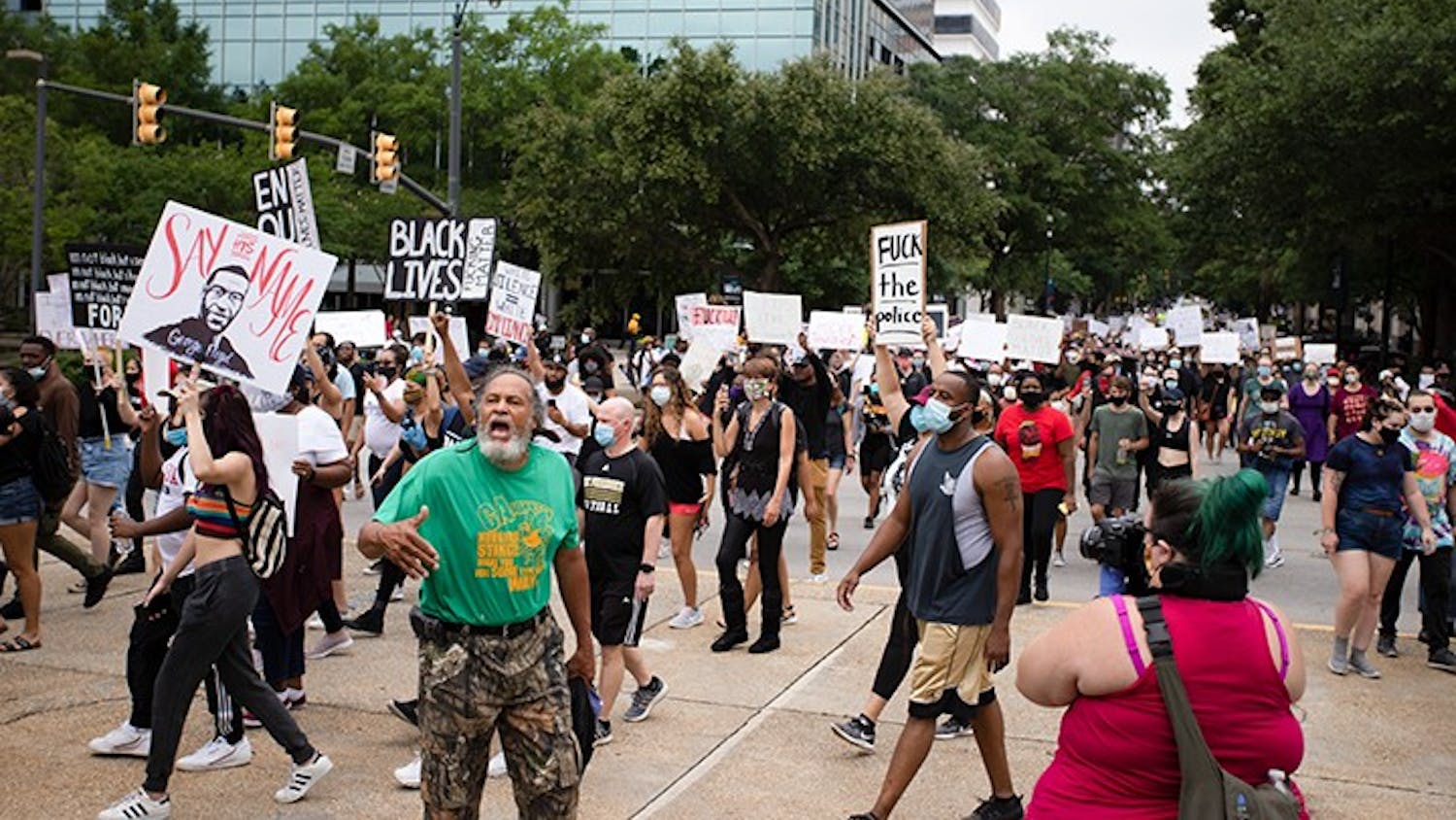 People marching at the “I Can’t Breathe” protest move towards the Statehouse in Columbia on May 30. 
