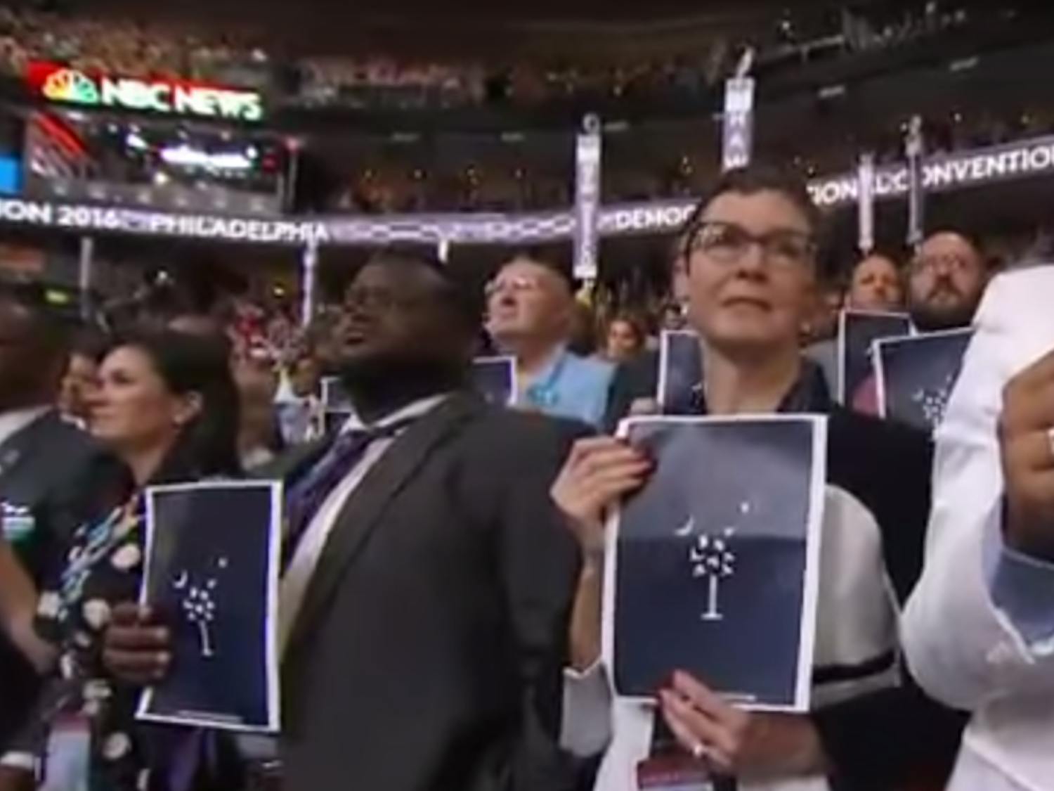 South Carolina delegates hold up symbolic placards in memory of the victims of the Emanuel AME church shooting in Charleston during speeches that two survivors of the attack gave at the Democratic National Convention in Philadelphia on July 27, 2016.