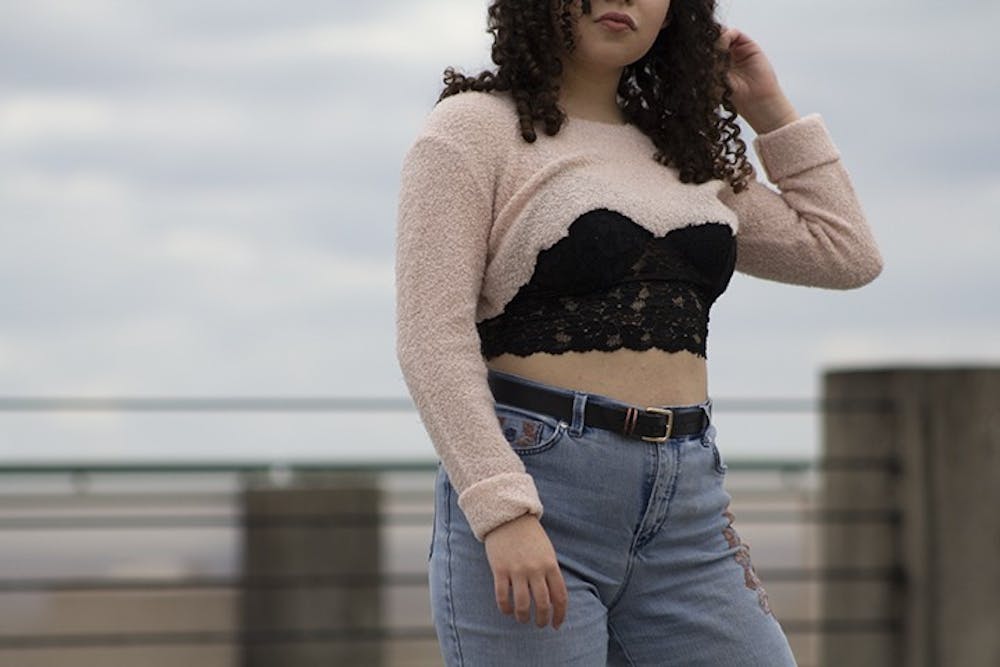  Wearing lace bralettes became a popular trend within the last four years and can be styled in a variety of ways, one being under thrifted sweaters with baggy pants and a belt.

