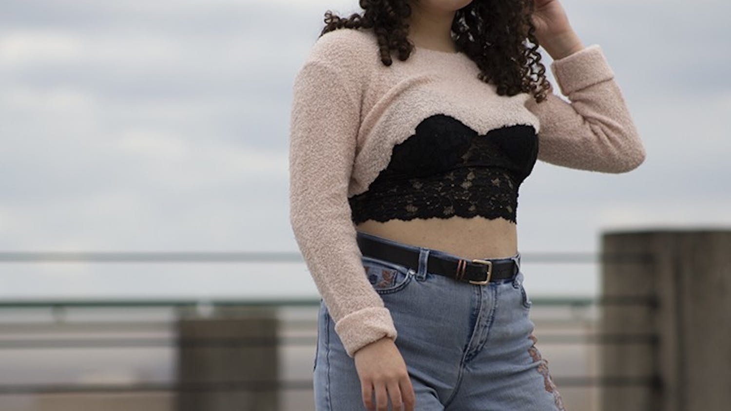  Wearing lace bralettes became a popular trend within the last four years and can be styled in a variety of ways, one being under thrifted sweaters with baggy pants and a belt.
