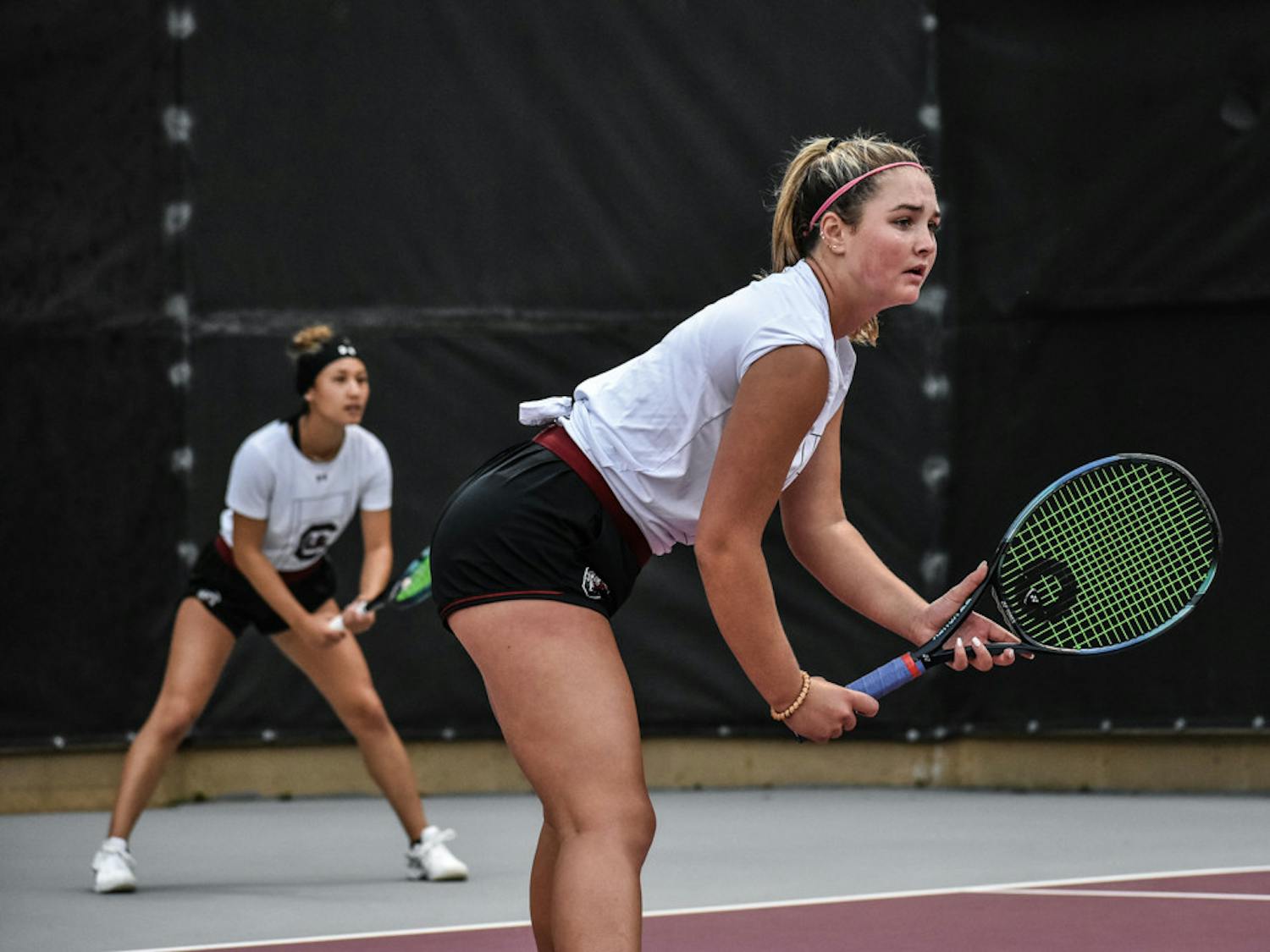 Freshman Alice Otis and sophomore Misa Malkin await a serve during during their doubles set against Kentucky on March 17, 2023. The Gamecock women’s tennis team won 4-3 in the match, but Otis and Malkin dropped the set 6-2.