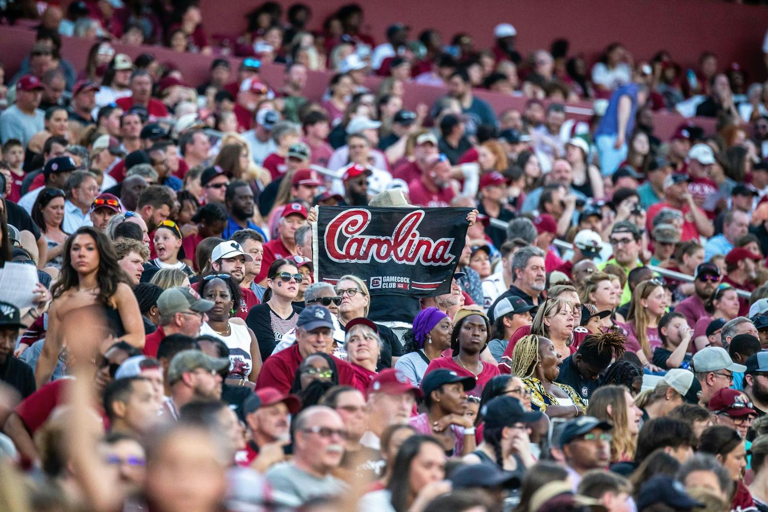 A fan holds up an autographed Carolina flag during the 2024 Garnet &amp; Black Spring Game at Williams-Brice Stadium on April 20, 2024. There were 32,500 ɫɫƵs fans in attendance to watch the Garnet team’s 17-0 victory over the Black team.