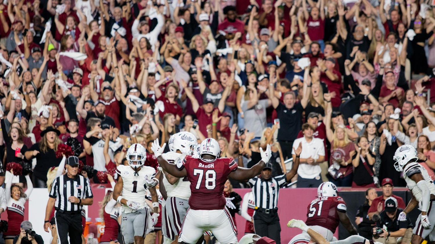 FILE — Then freshman offensive line Trovon Baugh poses as then redshirt senior running back Mario Anderson rushes in for a touchdown during South Carolina's game against Mississippi State at Williams-Brice Stadium on Sep. 23, 2023. Baugh, now a sophomore, is one of several lineman for the Gamecocks that is hoping to show a new and improved offensive game.