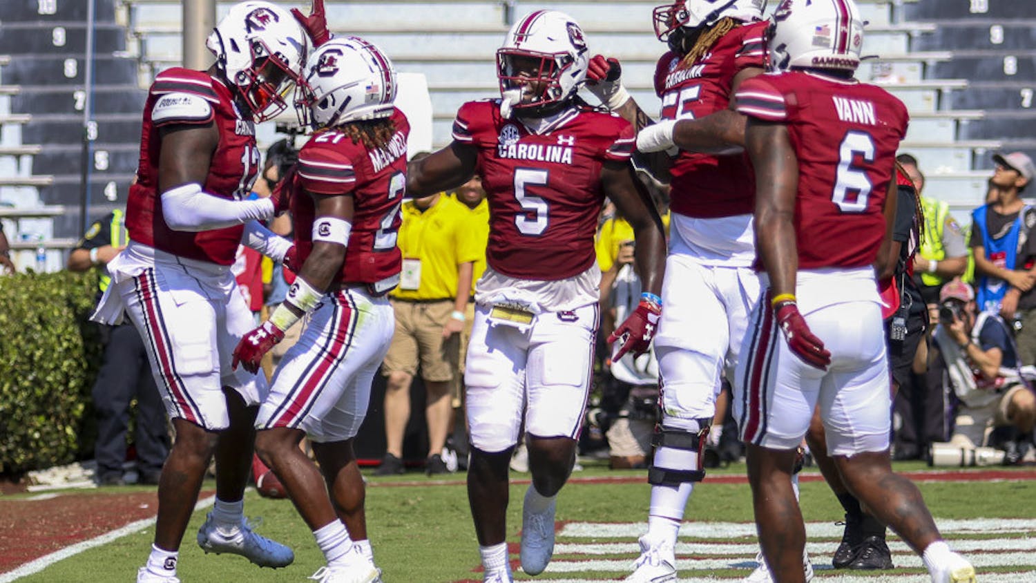FILE—Sixth-year wide receiver Dakereon Joyner (center) celebrates with his teammates after redshirt junior tight end Traevon Kenion (left) scores the first touchdown for South Carolina against Georgia on Sept. 17, 2022. The Bulldogs beat the Gamecocks 48-7.