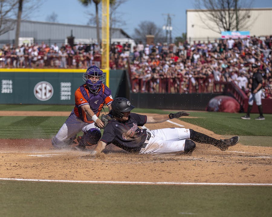 Senior infielder Braylen Wimmer slides onto home plate, scoring a point for South Carolina in the fifth inning against Clemson on March 5, 2023. The Gamecocks beat the Tigers 7-1.