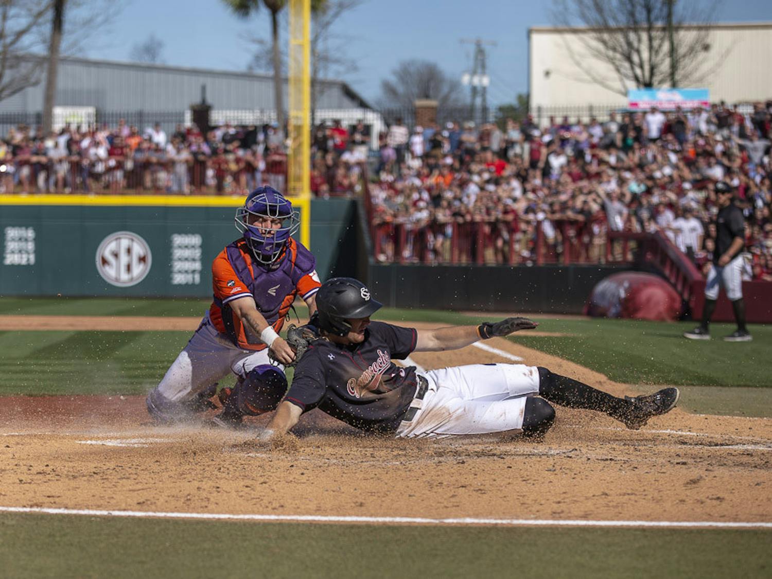 Senior infielder Braylen Wimmer slides onto home plate, scoring a point for South Carolina in the fifth inning against Clemson on March 5, 2023. The Gamecocks beat the Tigers 7-1.
