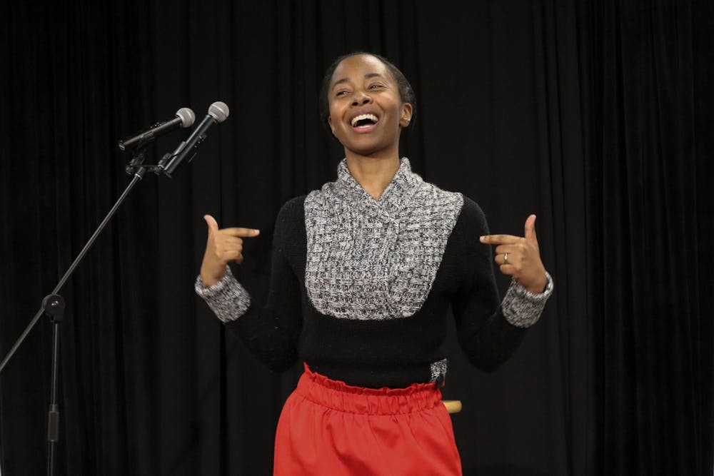 <p>Traci Neal, a USC alumni and NY Times published writer delivers some slam poetry during the UniVerse Popcorn &amp; Poetry event on Jan. 26, 2022. First Lady Patricia Harris-Pastides, creator of UniVERSE, was in attendance during the event.</p>