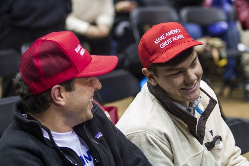 Presidential hopeful Donald J. Trump addresses economic concerns and answers audience questions at the T. Ed Garrison Arena in Clemson, South Carolina. Photographed: Anders Ike (Left) and Will Cobb (Right)