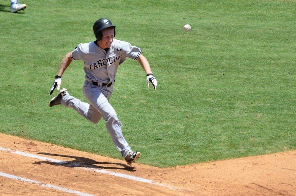Tanner English races the ball to first base after a bunt.